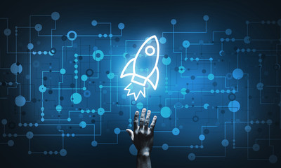 Technology idea concept with glowing rocket icon and touching it finger