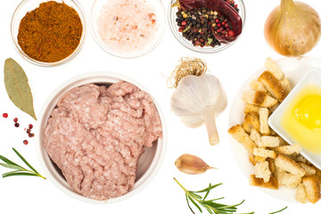 Raw ground chicken, herbs and spices for cutlets