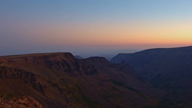 Dawn sunrise reveals Kiger Gorge from Summit of Steens Mountain glacier scoured canyon