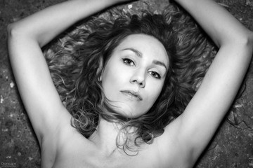 Women portrait. Seductive femme fatal, an artist, painter. Portrait in a studio. beautiful woman...