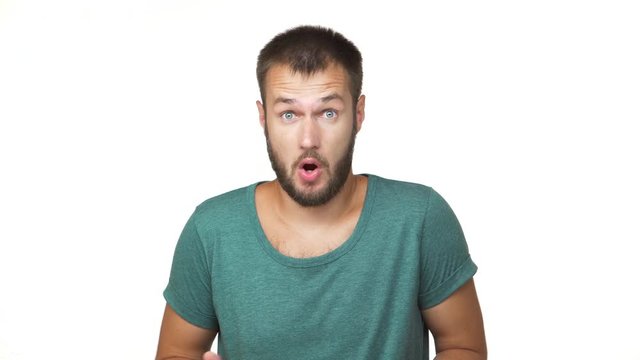 horizontal portrait of adult handsome guy with short brown hair being surprised frustrated expressing outrage confusion over white background closeup. Concept of emotions