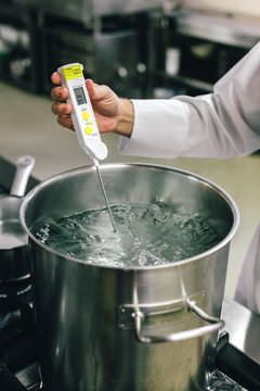 Professional Chef Taking the Water Temperature