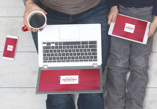 Laptop and Tablet Users Sitting on Wooden Floor with Smartphone