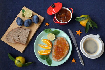New Year's breakfast, coffee, bread, jam. Festive table setting.