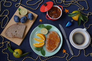 New Year's breakfast, coffee, bread, jam. Festive table setting.