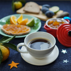 New Year's breakfast, coffee, bread, jam. Festive table setting.