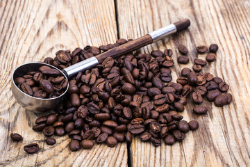 Bunch of coffee beans on wooden table