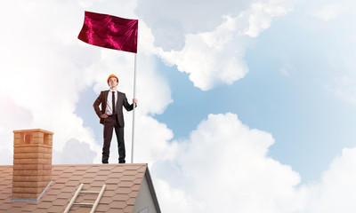 Young businessman with flag presenting concept of leadership. Mixed media