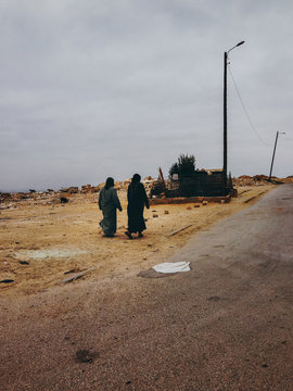 Two Muslim Women Walking in Street
