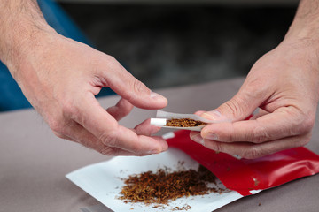 Closeup of cigarette being rolled