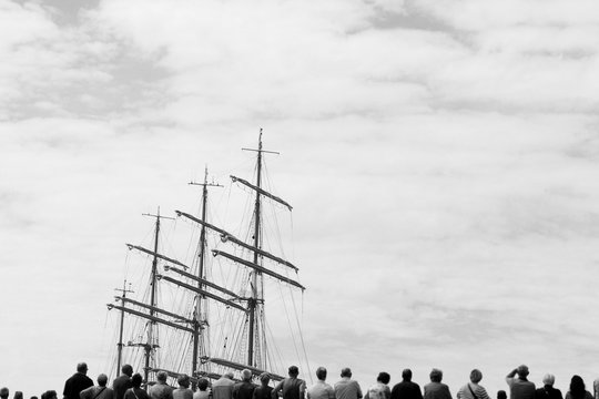 Audience looking at an historic sailing boat