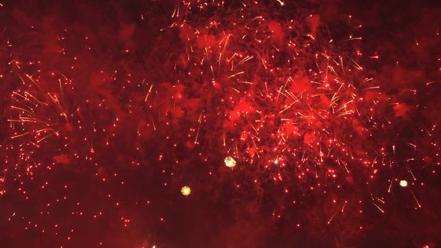 Colorful bright pyrotechnic show, flashes of salute firework of different colors close up view