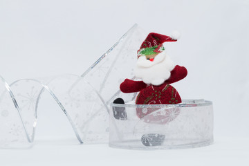 Adorable red Santa Claus with silver and white background. Christmas