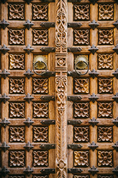 Old wooden door decorated with flower pattern