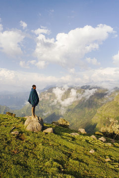 Africa, Ethiopia, The Simien Mountains National Park, UNESCO World Heritage Site, view looking towards the Nortern Escarpment near Sankaber, local shepherd boy