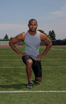 Man stretching for a track and field event