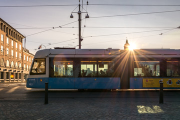 Naklejka na ściany i meble Gothenburg, Sweden - August 23, 2017: A Modern Blue Tram in Gothenburg with Sunflares