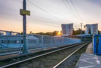 Fototapeta na wymiar Gothenburg, Sweden - August 23, 2017: Sunset at a Residential Complex with Tram Rails on Hisingen, Gothenburg