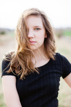Portrait of a teen girl in black top