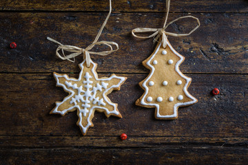 Various cookies for children with Christmas symbols in their environment.