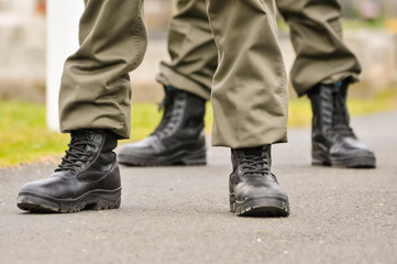 Men and women from Republican Sinn Fein, wear paramilitary uniforms