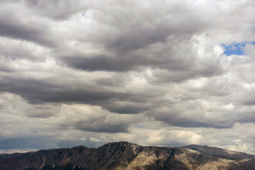 Fototapeta premium Cumulus clouds over the mountains