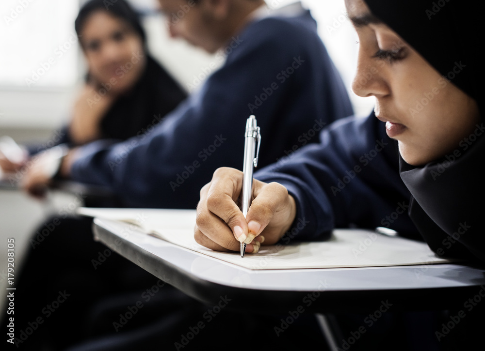 Wall mural diverse muslim children studying in classroom