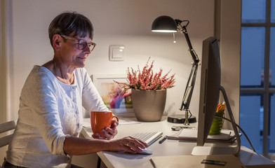 Senior Woman Working Late