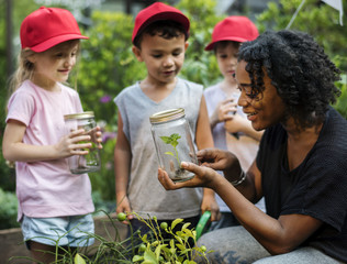 Teacher and kids school learning ecology gardening