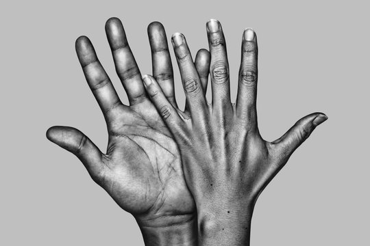 Detail of the hands of a couple. Black and white.
