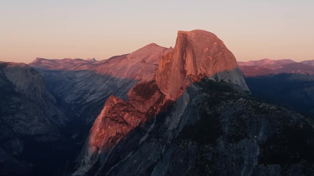 Sun setting on half dome at yosemite recorded from glacier point