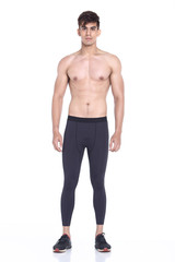 Fototapeta na wymiar Full body length portrait of a young man wearing fitness sporty outfit