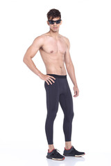 Full body length portrait of a young man wearing fitness sporty outfit