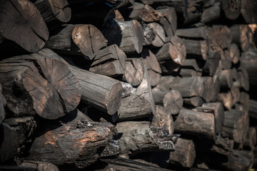 Fototapeta na wymiar Natural wooden background - closeup of chopped firewood.