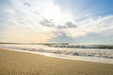 Fototapeta na wymiar sunset and wave bubble seascape and blue sky on the beach