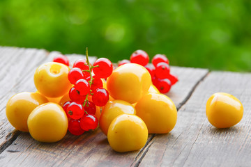 Yellow cherry on a wooden table