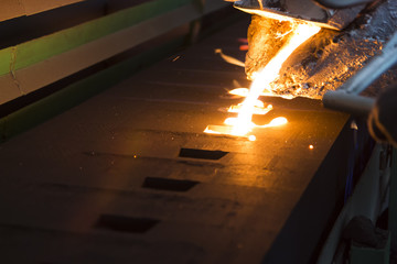 Iron molten metal pouring in sand mold ;