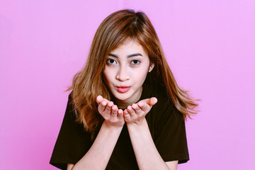 Fashion photo of young girl on pink background