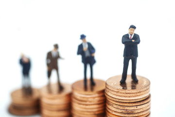 Miniature people: small figures businessmen