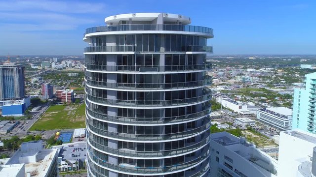 Aerial inspection drone orbit highrise building penthouse