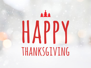 Massage " Happy thanksgiving" on blurred bokeh with snowfall background. © bunditinay