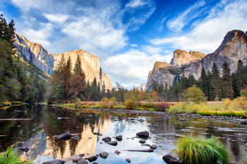 Yosemite Valley, as seen from Valley View scenic point, at the bank of the Merced River on an autumn day