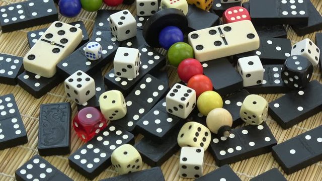 Rotating various game bones, domino, black and white dices and wooden child toys