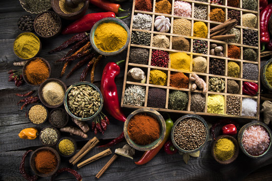 Wooden box with spices and herbs