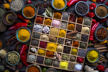Wooden box with spices and herbs