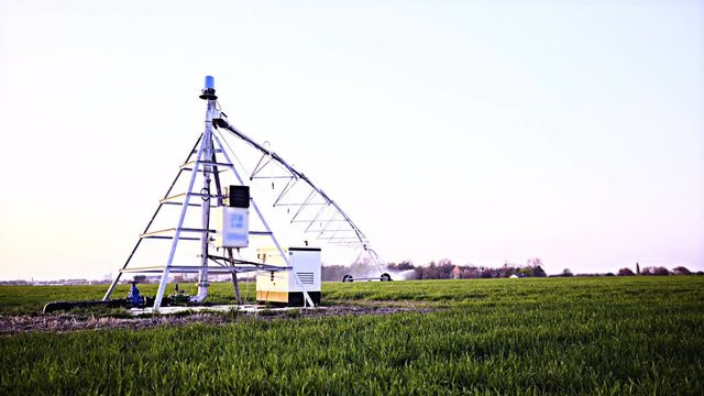 Sprinkler source system in middle of field 4K