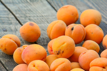 Apricots in the garden on a wooden table