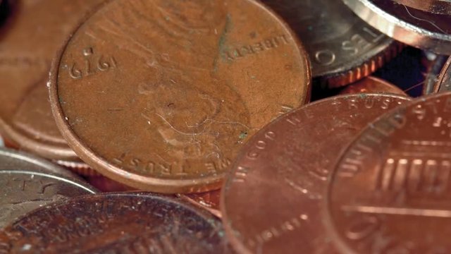 Close pile of US coins penny quarter nickel money