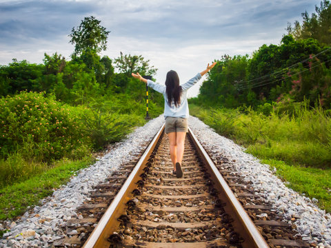 Woman Walking On Railway