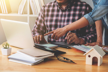 Young colleagues designers working together on a creative project and color samples for selection, Color swatch samples, Brainstorming Planning Partnership, creative graphic design working desktop